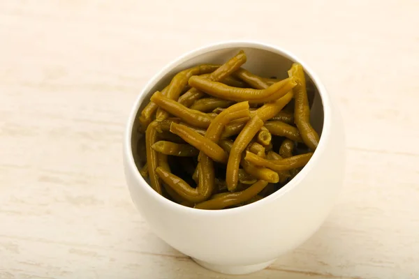 Canned Green beans on white table