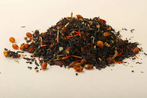 Aroma tea heap with fruit, berries and herbs