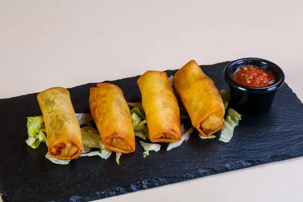 Spring roll with tomato sauce