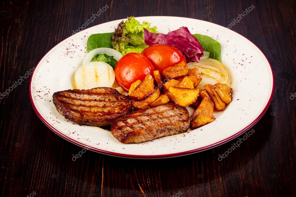 Grilled pork with vegetables and herbs