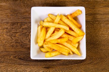 Patates kızartması patates ahşap arka plan üzerinde