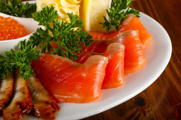 Fish plate - Trout fillet, red caviar and eel served lemon — Stock Image Fish Plate Trout Fillet Red Caviar Eel Served Lemon Royalty Free Stock Photos