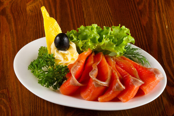 Sliced salmon with butter