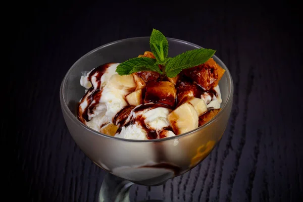 Delicious ice cream with caramel, peach and banana bites