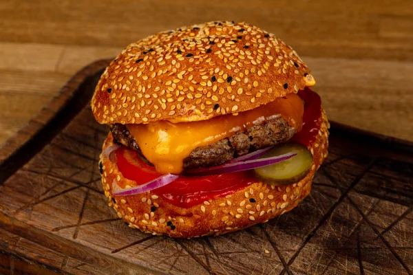 Tasty burger with meat and cheese