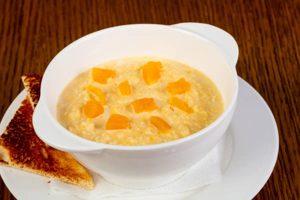 Pumpkin porridge breakfast with bread — Stock Image Pumpkin Porridge Breakfast Bread Stock Photo