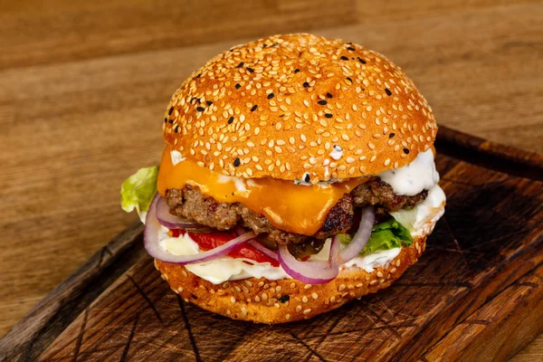 Tasty burger with meat and cheese