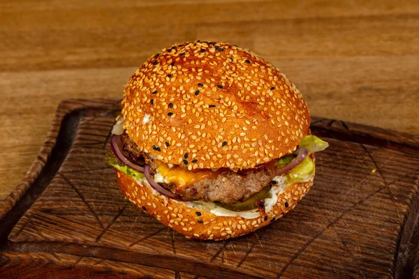 Tasty burger with meat and cheese