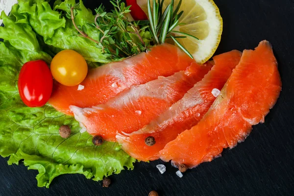 Raw trout fillet with salt and spices