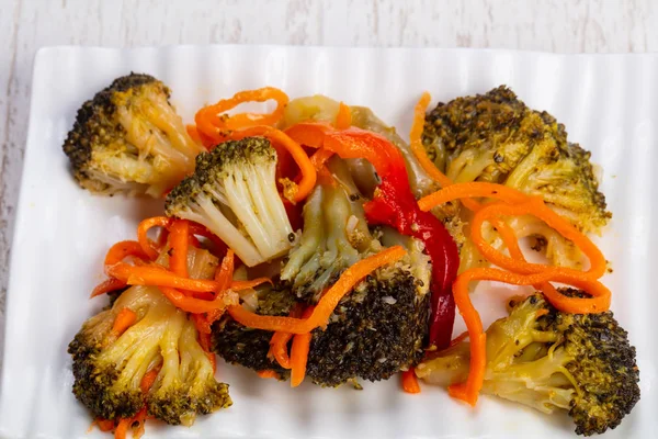 Tasty pickled salad with broccoli, carrot and bell pepper