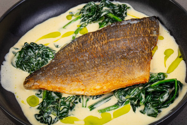 Dorada fish fillet with spinach