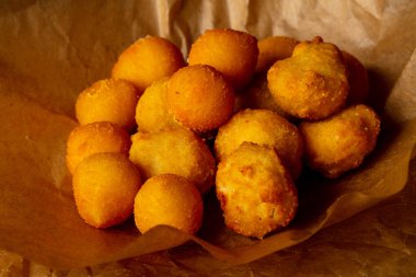 Hot tasty potato balls heap clipart