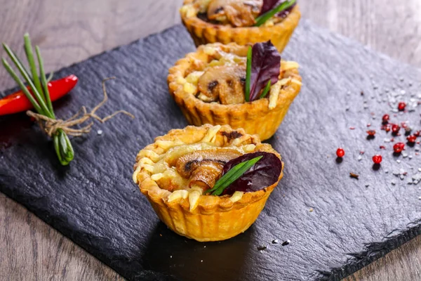 Canape with baked mushroom and cheese