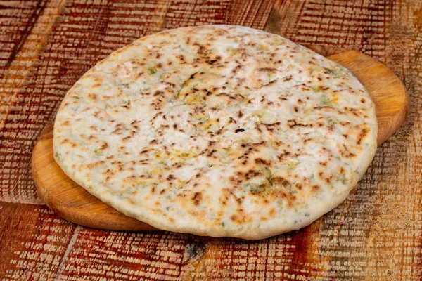 Indian bread paratha over the wooden background