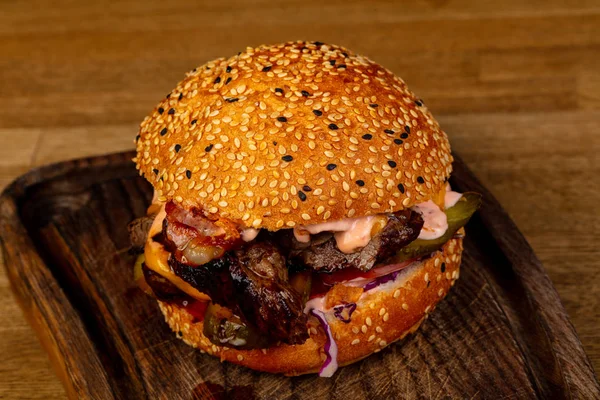 Tasty burger with meat and cheese