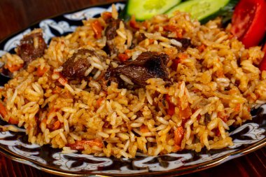 Uzbek traditional Plov with beef clipart