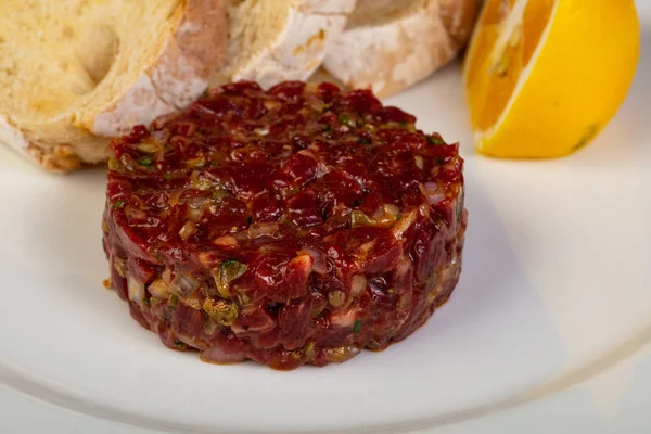 Beef tartare with bread and lemon