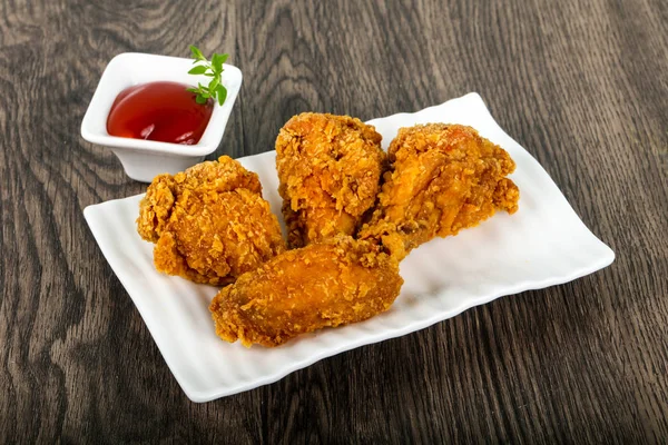 Crispy chicken wings with  ketchup