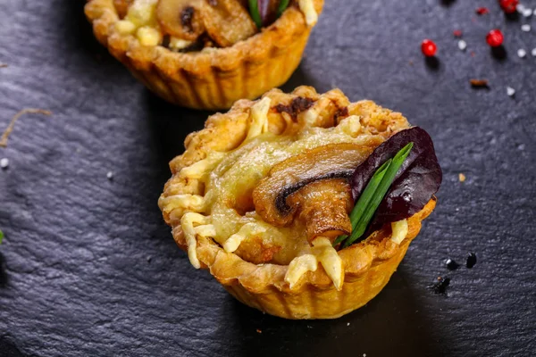 Canape with baked mushroom and cheese