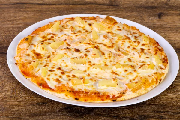 Pineapple pizza with soft cheese