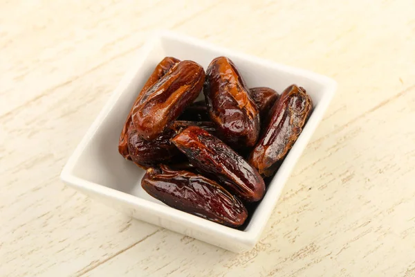 Sweet dates fruit heap in the bowl