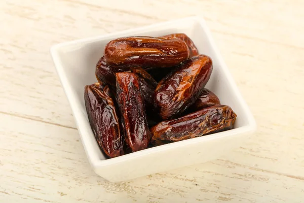 Sweet dates fruit heap in the bowl