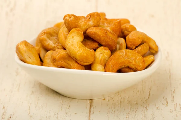 Cashewnüsse Häufen Sich Über Hölzernen Hintergrund — Stockfoto