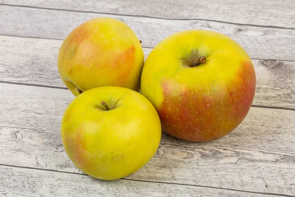 Ripe sweet apples over background