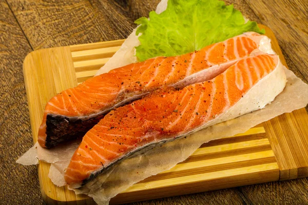 Raw salmon slice ready for baking with spices