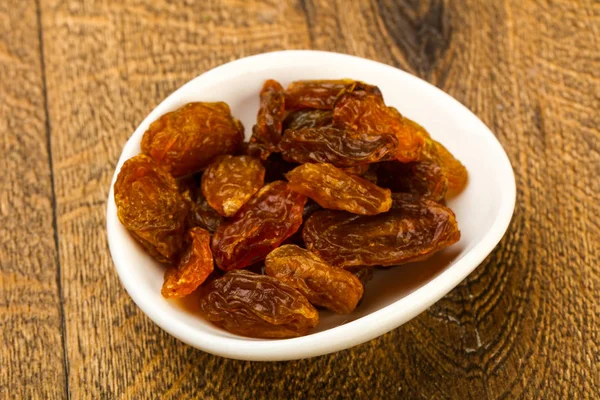 Raisin Sec Dans Bol Sur Fond Bois — Photo