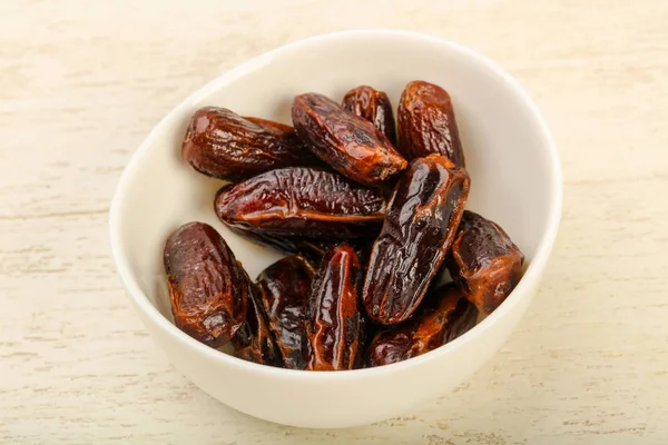 Sweet dates fruit heap in the bowl