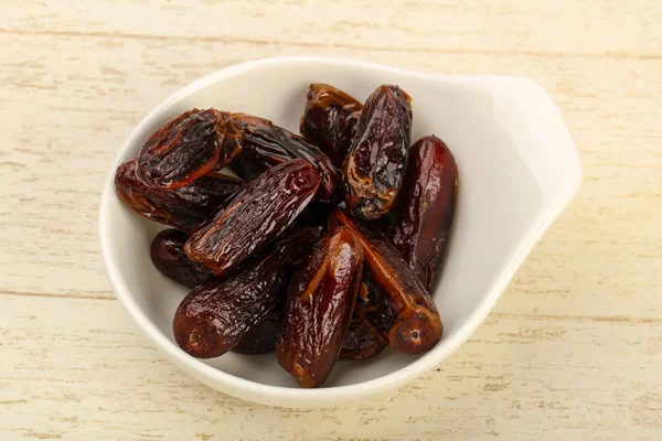 Sweet dates fruit heap in the bowl