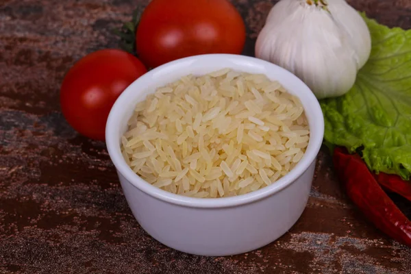 Raw Uncooked Rice Bowl Served Pepper Salad Leaves — Stock Photo, Image