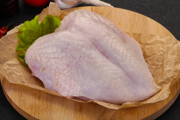 Raw chicken breast with skin