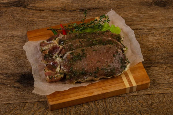 Raw marinated pork steak — Stock Photo, Image
