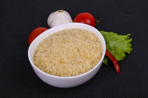 Raw uncooked rice in the bowl — Stock Photo, Image