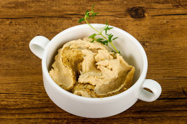 Vegetarian Humus with sesame seeds and thyme leaves