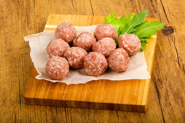 Raw meat balls for cooking
