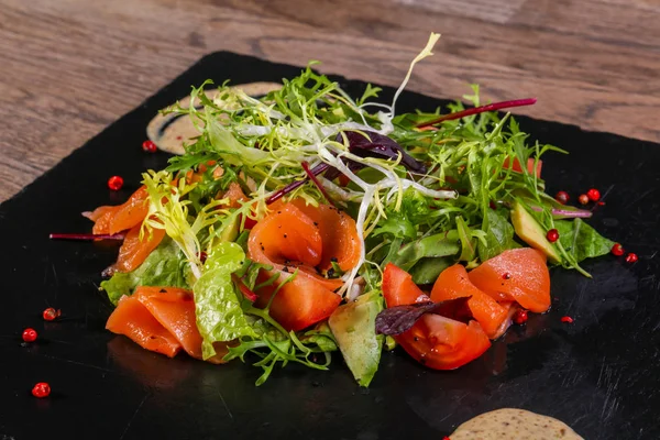 Salad with salmon and avocado with nut sauce