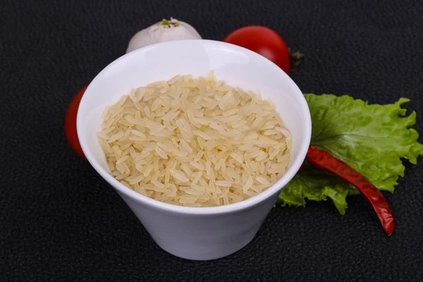 Raw uncooked rice in the bowl — Stock Photo, Image