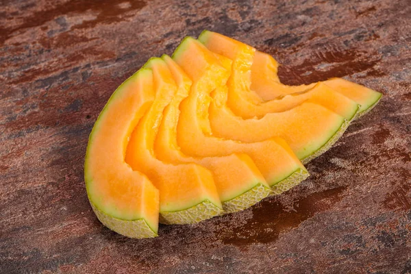 Rebanadas sabroso dulce en rodajas de melón — Foto de Stock