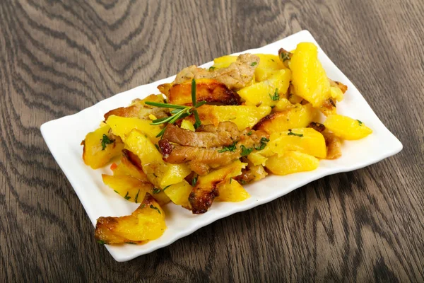 Fried potato with pork — Stock Photo, Image