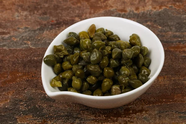 Capers in the bowl — Stock Photo, Image