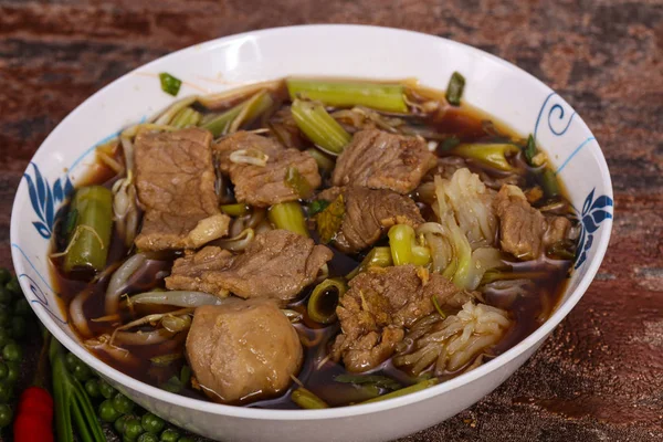 Thai style soup with meat and mushrooms — Stock Photo, Image