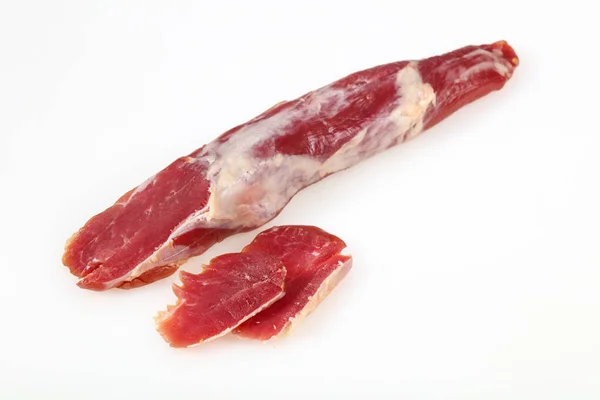 Wędzone mięso wieprzowe na białym tle — Zdjęcie stockowe