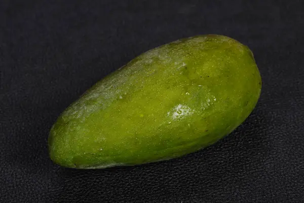 Green tasty mango over wooden background — Stock Photo, Image