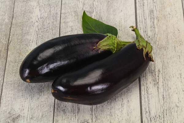 Ripe tasty Eggplant over wooden background — Stock Photo, Image