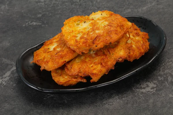 Roasted potato pancakes in the bowl — Stock Photo, Image