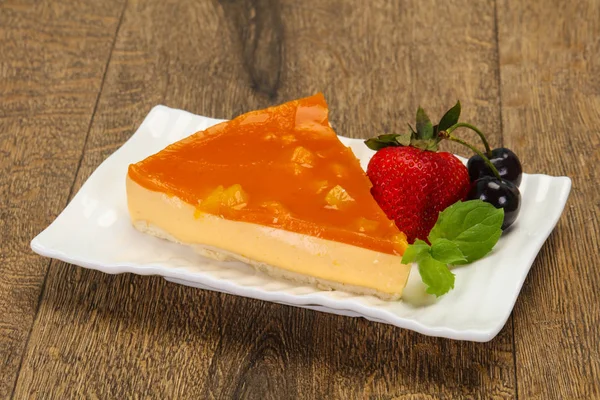 Cheesecake with apricot served strawberry — Stock Photo, Image