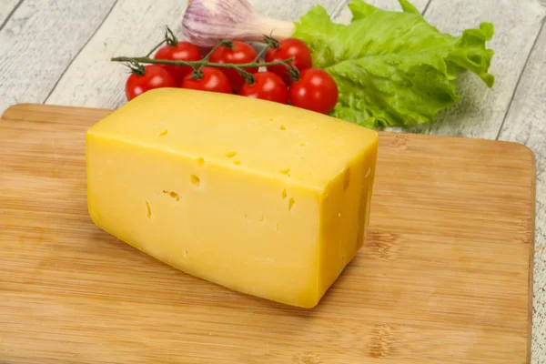 Hard yellow tasty cheese brick — Stock Photo, Image